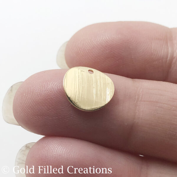 Gold filled round disc wave
